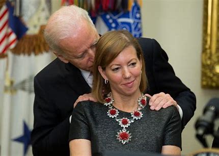 Joe Biden sniffing hair of young girl