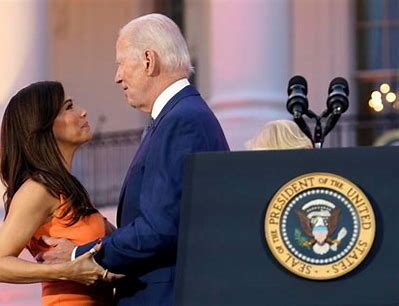Joe Biden sniffing a woman