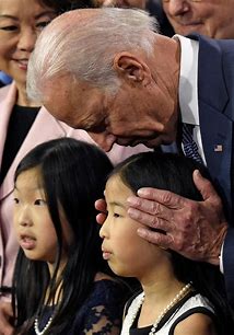 Joe Biden up close with a child
